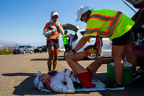 Karla Kent stretches during a brief pause
